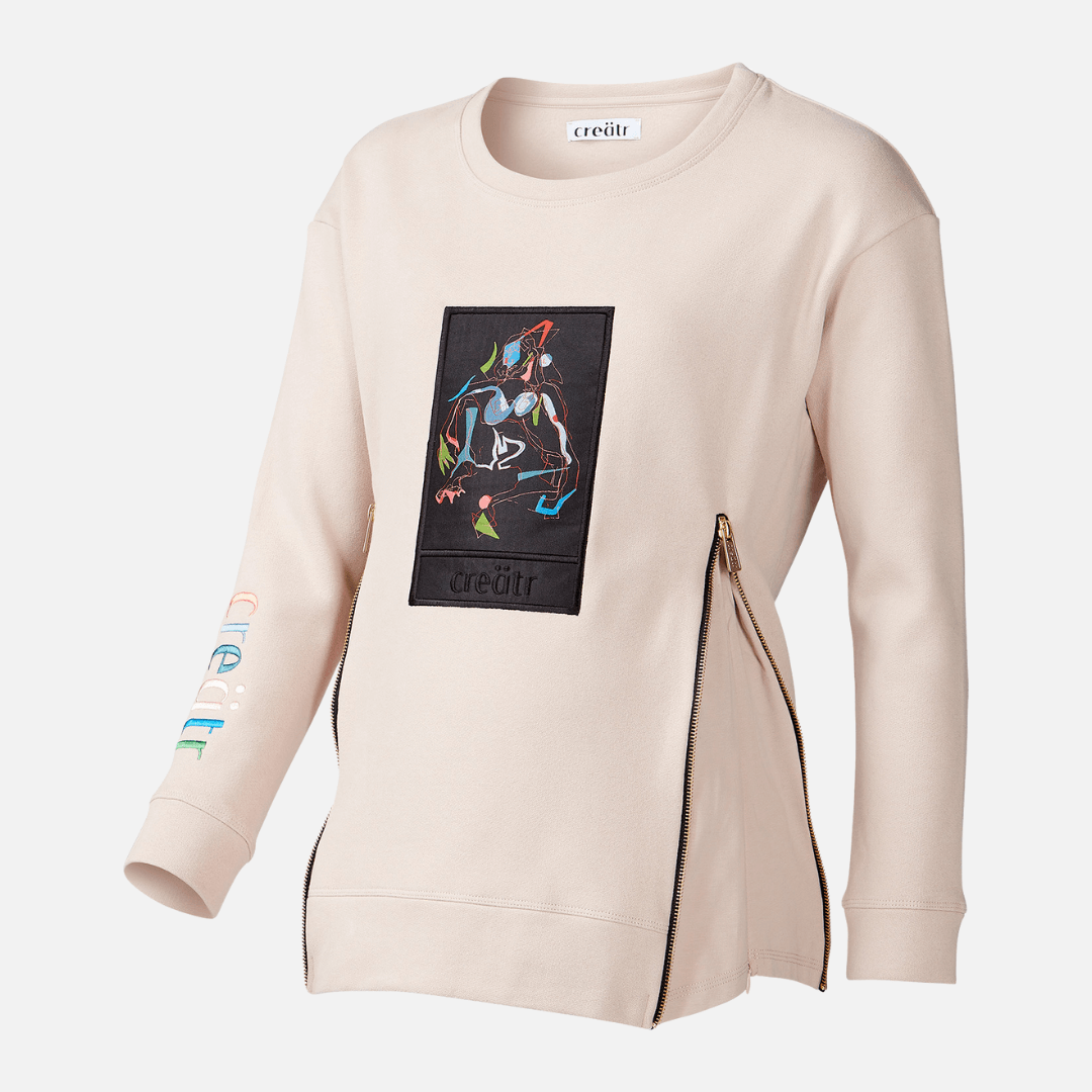 Rosa-beige creätr Pulli mit Reisverschluss und bunter Stickerei